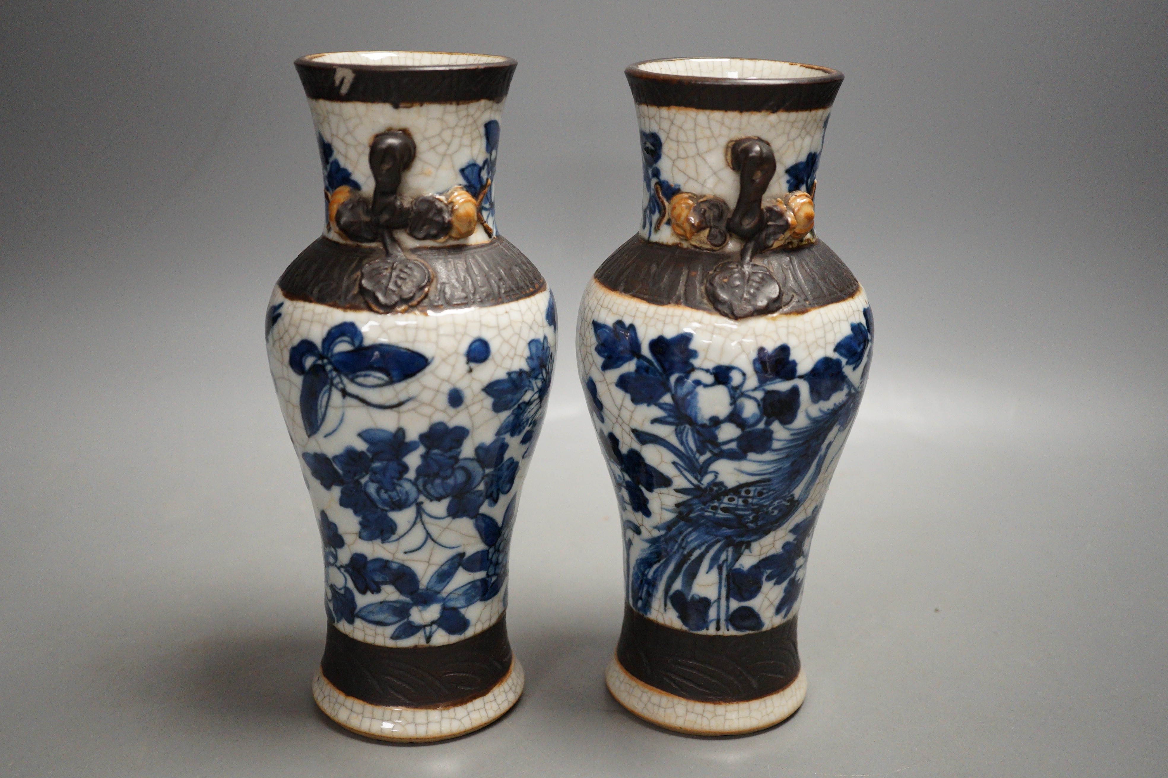 A pair of late 19th century Chinese blue and white crackle glaze vases, 21cm